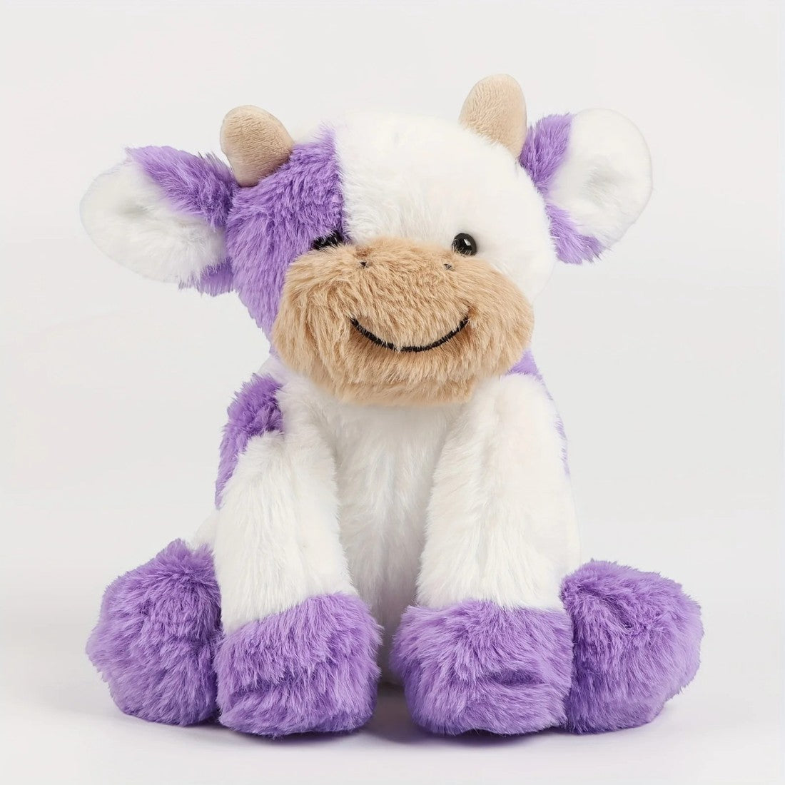 Mooie zachte kleurrijke koe knuffel