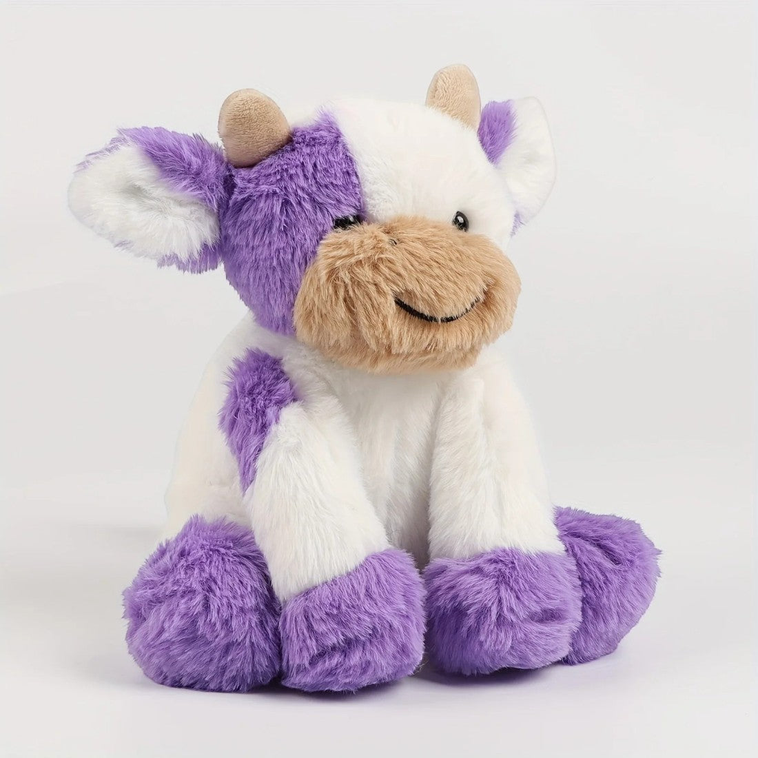 Mooie zachte kleurrijke koe knuffel