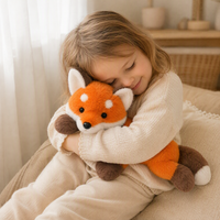 Liggende oranje vos knuffel