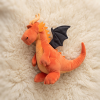 Oranje draak knuffel met zwarte vleugels