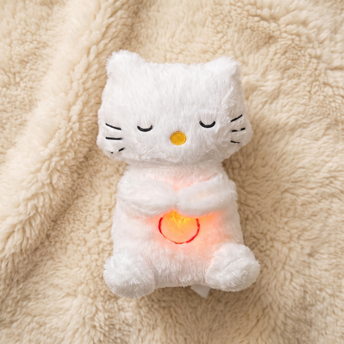 Ademende kat knuffel met lichtgevend slaapliedje